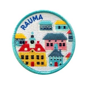 A sleeve badge with a fairytale-like playful city illustration.