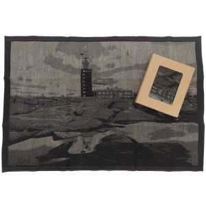 Black and white towel with a pattern of the Kylmäpihlaja lighthouse.